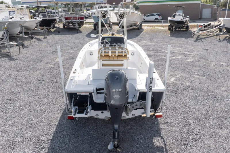 Slide: The Image of 2021 Sportsman Masters 227 Bay Boat with Yamaha engine on trailer in a boatyard. - 36