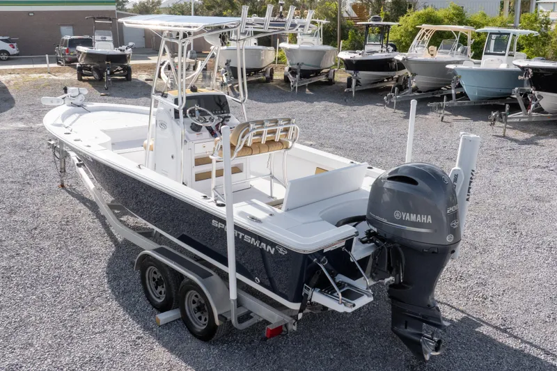 Slide: The Image of 2021 Sportsman Masters 227 Bay Boat with Yamaha 200 engine, displayed outdoors. - 37