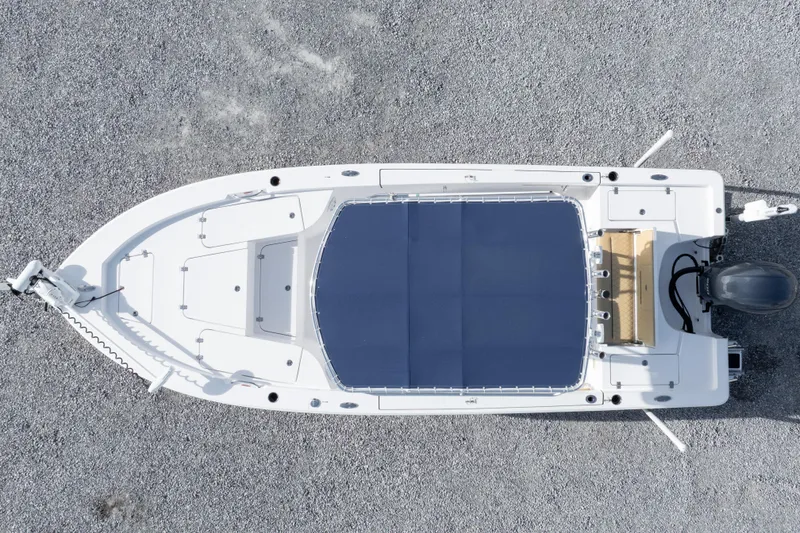 Slide: The Image of 2021 Sportsman Masters 227 Bay Boat on trailer in a marina setting. - 41