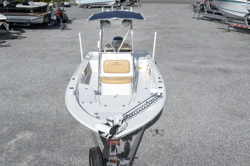 Slide: The Image of 2021 Sportsman Masters 227 Bay Boat on trailer, parked on gravel lot. - 42
