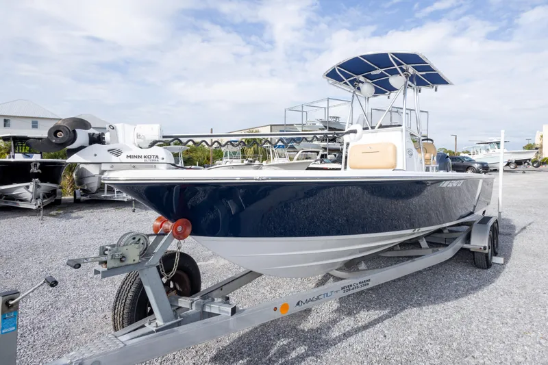 Slide: The Image of 2021 Sportsman Masters 227 Bay Boat on trailer, parked outdoors under cloudy sky. - 9