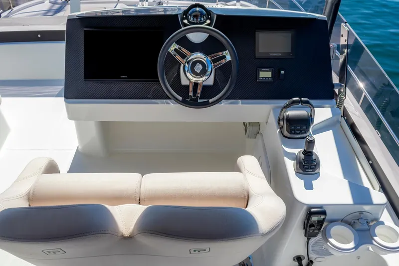 Slide: The Image of Helm station of 2024 Fountaine Pajot MY5 yacht with modern controls and steering wheel. - 10