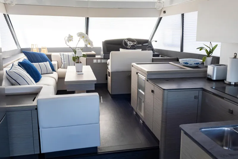 Slide: The Image of Luxurious interior of 2024 Fountaine Pajot MY5 yacht with modern kitchen and seating area. - 15