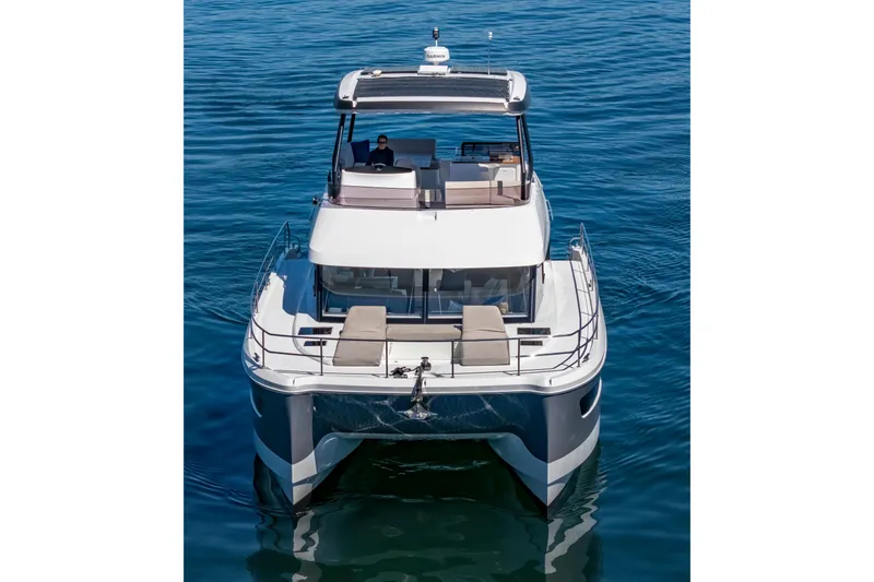 Slide: The Image of 2024 Fountaine Pajot MY5 yacht on calm blue water, showcasing sleek design and luxury features. - 3