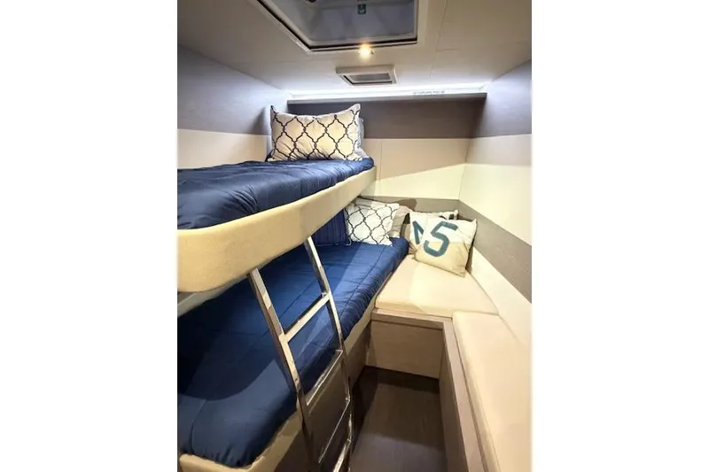 Slide: The Image of 2024 Fountaine Pajot MY5 yacht closet with hangers, showcasing sleek interior design. - 35