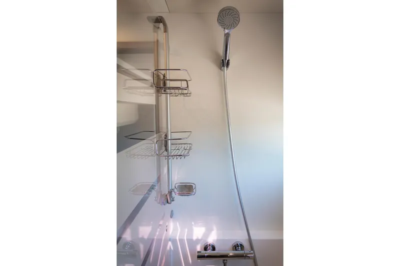 Slide: The Image of Modern shower setup in 2024 Fountaine Pajot MY5 yacht bathroom. - 44