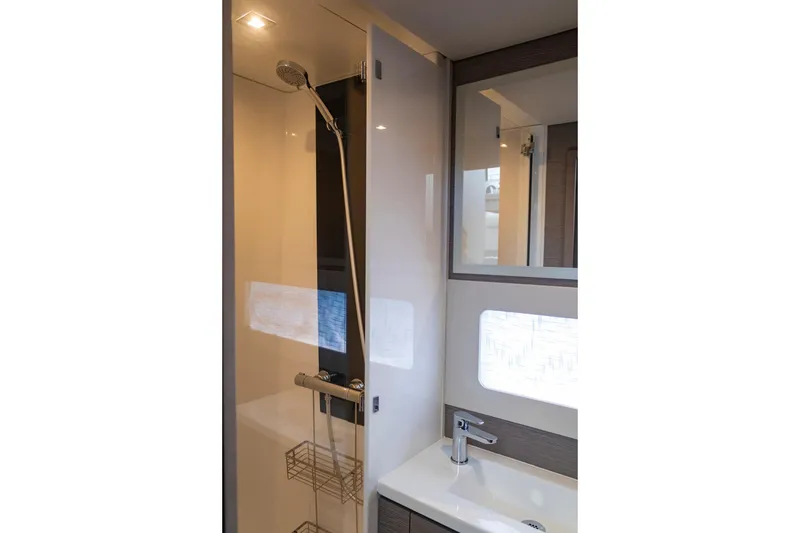 Slide: The Image of Modern bathroom in 2024 Fountaine Pajot MY5 yacht, featuring sleek shower and sink design. - 46