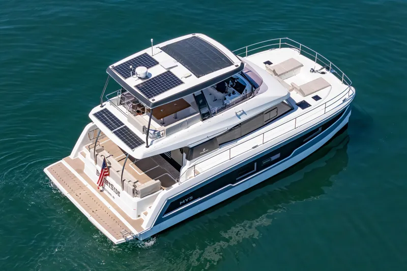 Slide: The Image of 2024 Fountaine Pajot MY5 yacht with solar panels, cruising on calm blue waters. - 5