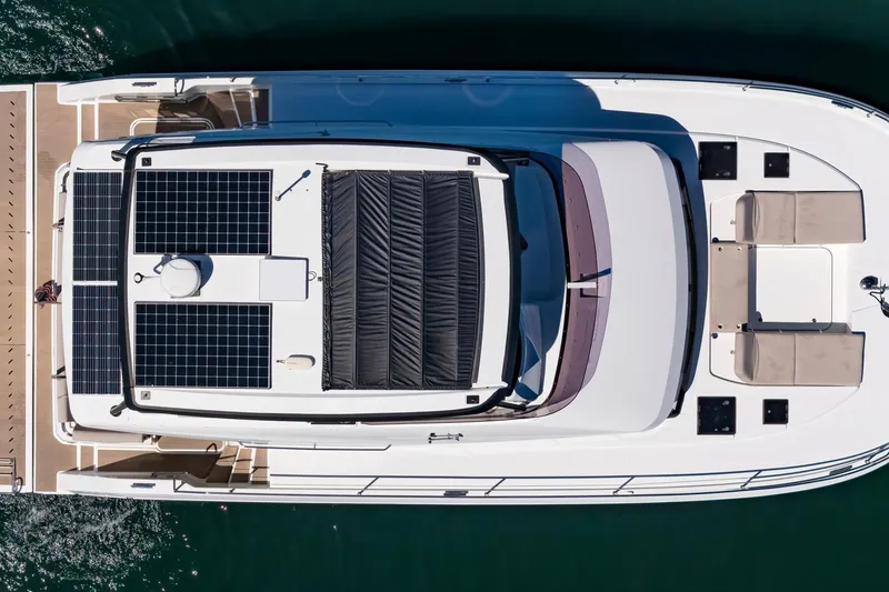 Slide: The Image of Top view of 2024 Fountaine Pajot MY5 yacht with solar panels and seating area. - 62