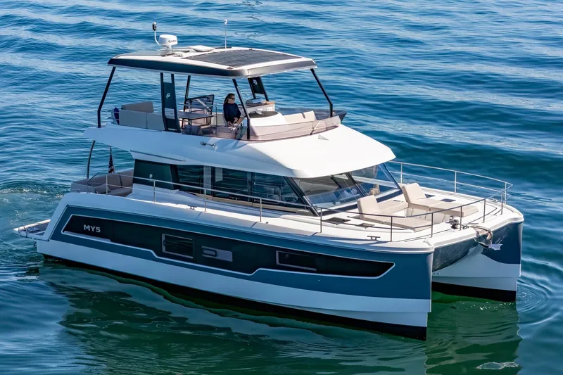 Slide: The Image of 2024 Fountaine Pajot MY5 luxury yacht cruising on open water. - 64