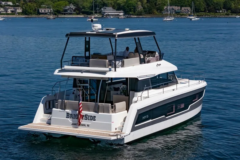 Slide: The Image of 2024 Fountaine Pajot MY5 yacht cruising on a serene blue lake. - 67