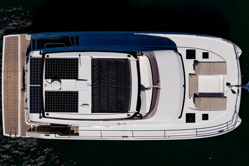 Slide: The Image of Overhead view of 2024 Fountaine Pajot MY5 yacht with solar panels and spacious deck. - 69