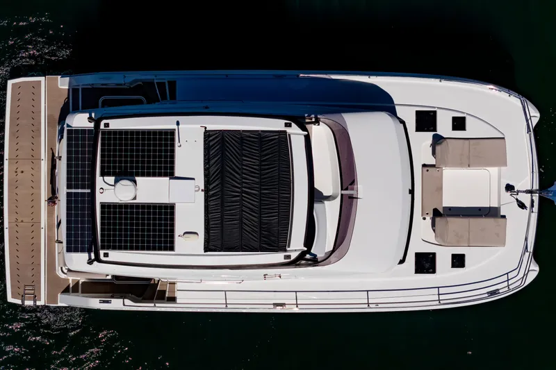 Slide: The Image of Top view of 2024 Fountaine Pajot MY5 yacht with solar panels and seating area. - 4