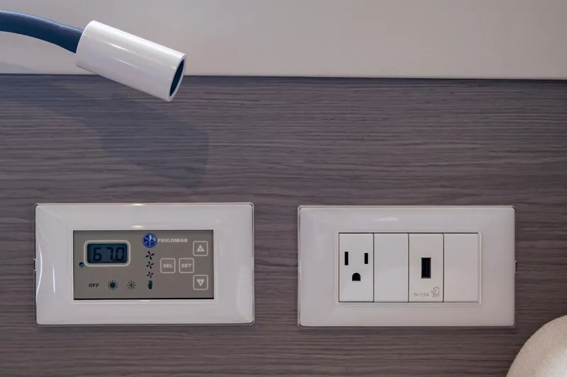 Slide: The Image of Control panel and power outlet on 2024 Fountaine Pajot MY5 yacht interior. - 45