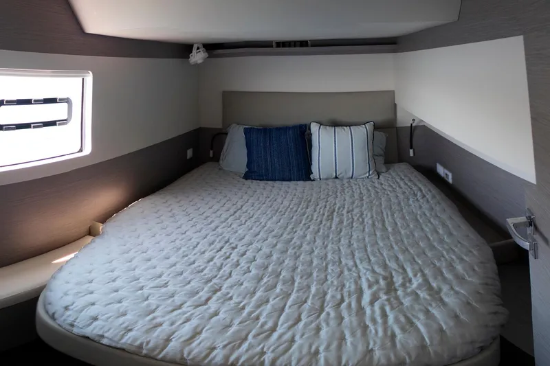 Slide: The Image of Luxurious bedroom interior of 2024 Fountaine Pajot MY5 yacht with cozy bedding. - 47