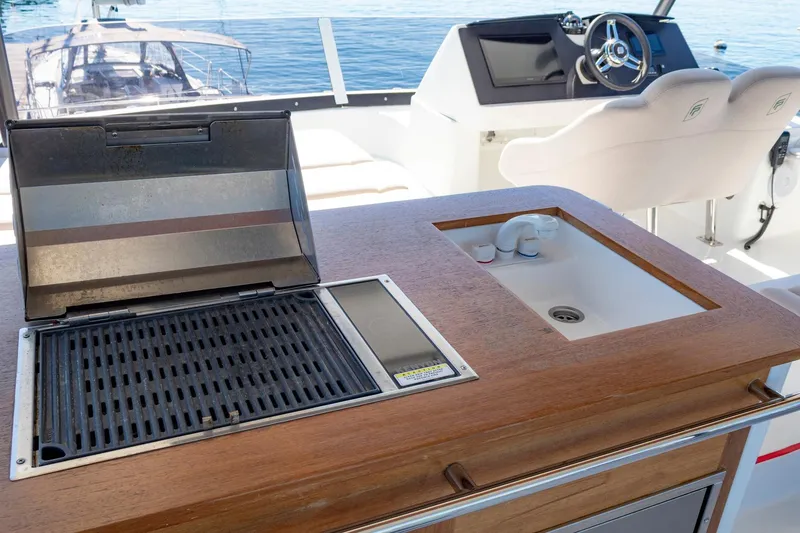 Slide: The Image of Outdoor kitchen on 2024 Fountaine Pajot MY5 yacht with grill and sink. - 57