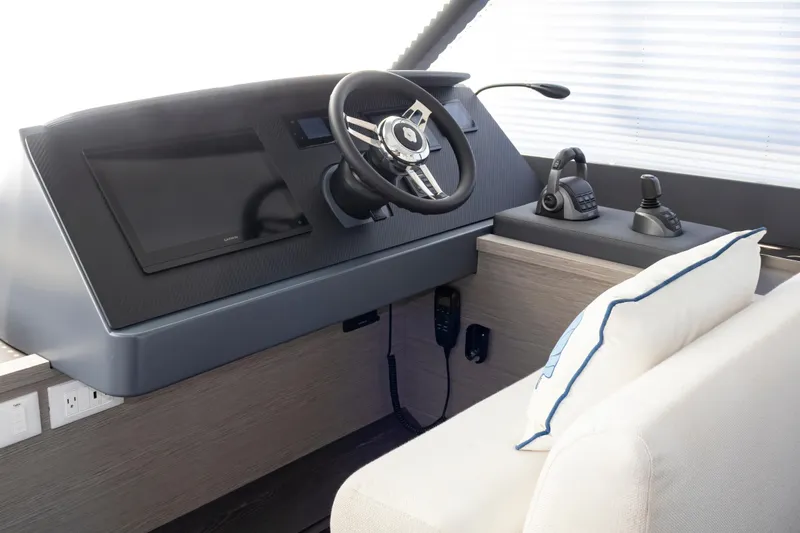 Slide: The Image of 2024 Fountaine Pajot MY5 helm station with modern controls and sleek design. - 9