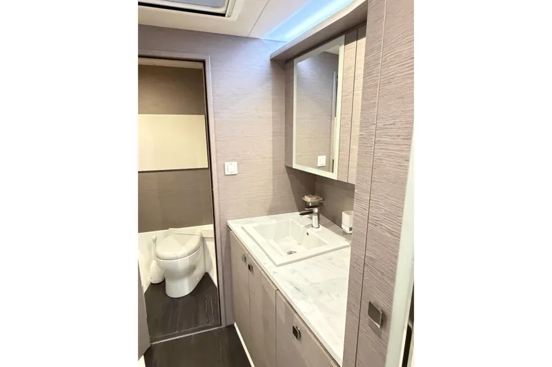 Slide: The Image of Luxurious bathroom interior of 2024 Fountaine Pajot MY5 yacht, featuring modern fixtures and elegant design. - 16