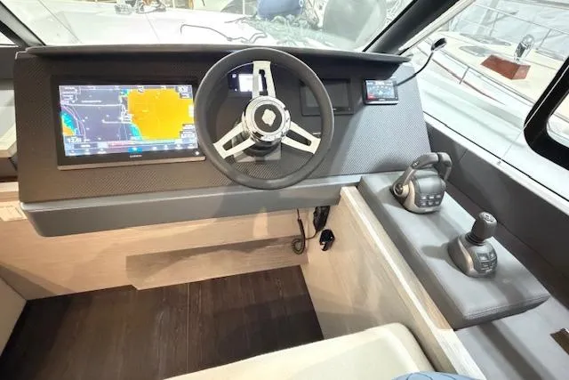 Slide: The Image of 2024 Fountaine Pajot MY5 helm with modern navigation and control systems. - 17