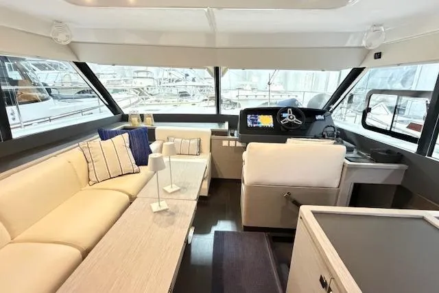 Slide: The Image of Luxurious interior of 2024 Fountaine Pajot MY5 yacht with plush seating and modern helm. - 18