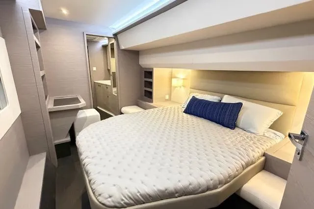 Slide: The Image of Luxurious bedroom interior of 2024 Fountaine Pajot MY5 yacht with modern design and cozy bedding. - 25