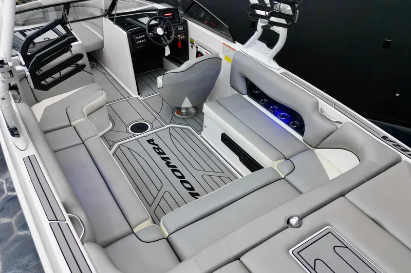 Slide: The Image of 2019 Moomba Mojo boat interior with sleek seating and modern dashboard design. - 4