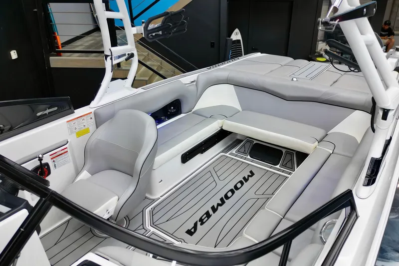 Slide: The Image of 2019 Moomba Mojo boat interior with gray seating and flooring. - 6