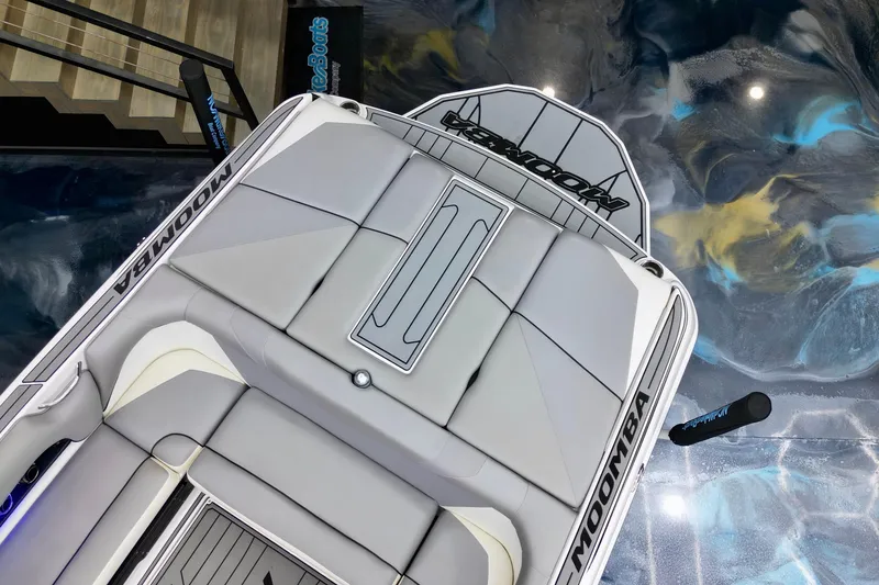 Slide: The Image of 2019 Moomba Mojo boat interior with sleek gray seating and stylish design. - 9