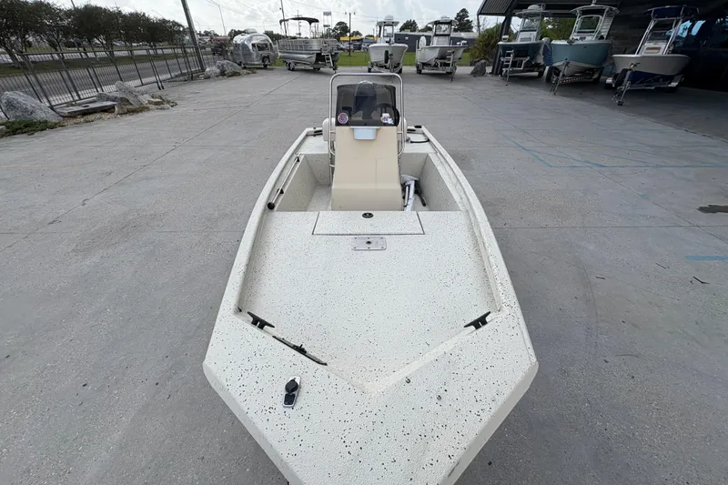 Slide: The Image of 2012 Xpress 1650VJF boat on display in a marina setting. - 10