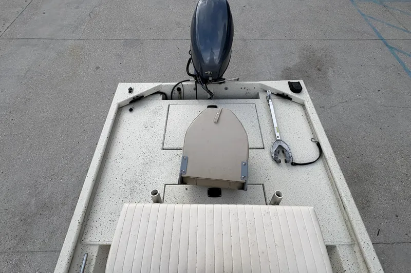 Slide: The Image of 2012 Xpress 1650VJF boat deck with motor and seating. - 17