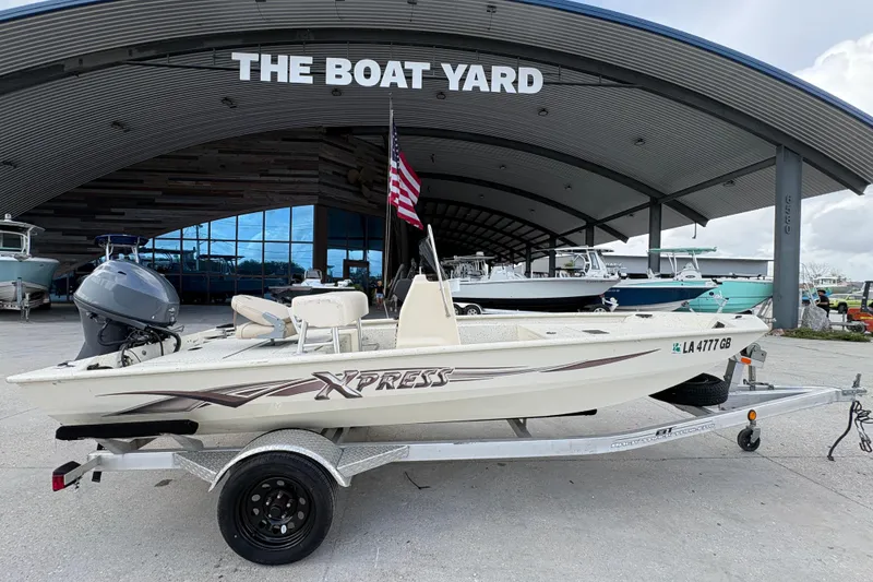 Slide: The Image of 2012 Xpress 1650VJF boat on trailer at The Boat Yard dealership. - 2