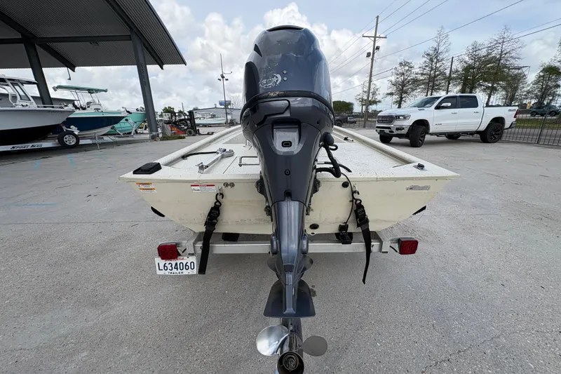 Slide: The Image of 2012 Xpress 1650VJF boat on trailer, rear view with outboard motor. - 4