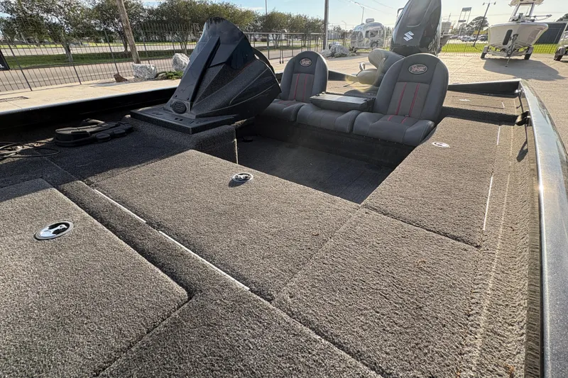 Slide: The Image of 2016 Ranger RT188 boat interior with carpeted deck and dual seats. - 14
