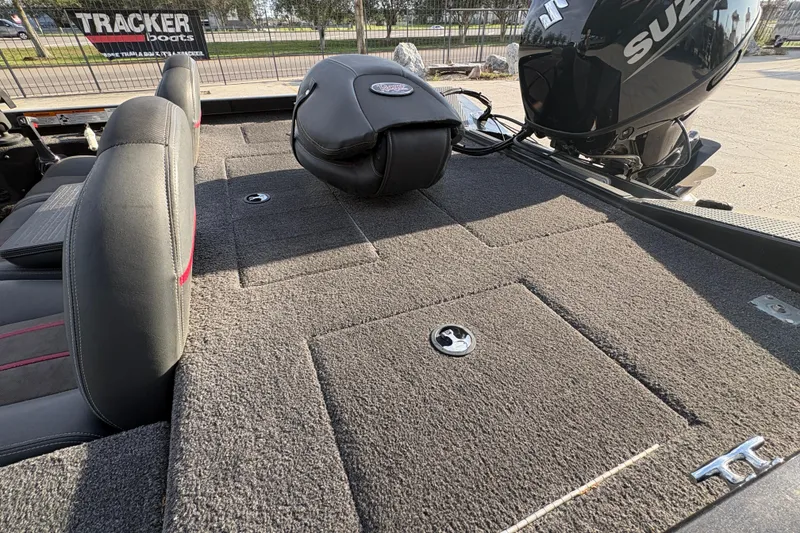 Slide: The Image of 2016 Ranger RT188 boat deck with Suzuki motor and Tracker Boats sign. - 15