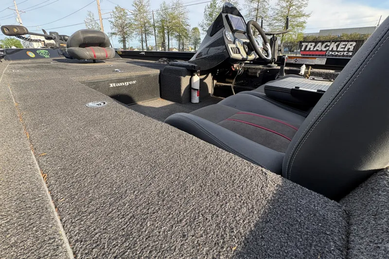 Slide: The Image of 2016 Ranger RT188 boat interior with steering wheel and seating, featuring Tracker branding. - 16