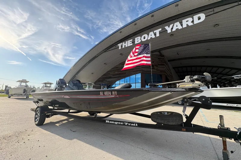 Slide: The Image of 2016 Ranger RT188 boat on trailer at The Boat Yard, American flag displayed. - 2