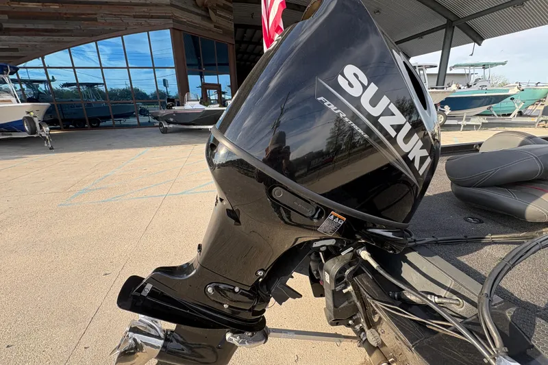 Slide: The Image of 2016 Ranger RT188 with Suzuki outboard motor at a marina. - 21