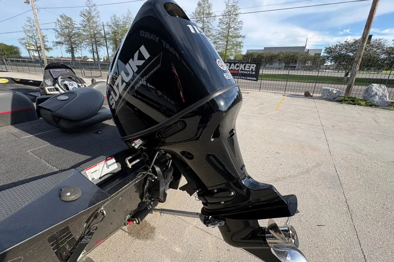 Slide: The Image of 2016 Ranger RT188 boat with Suzuki outboard motor in a parking lot. - 22