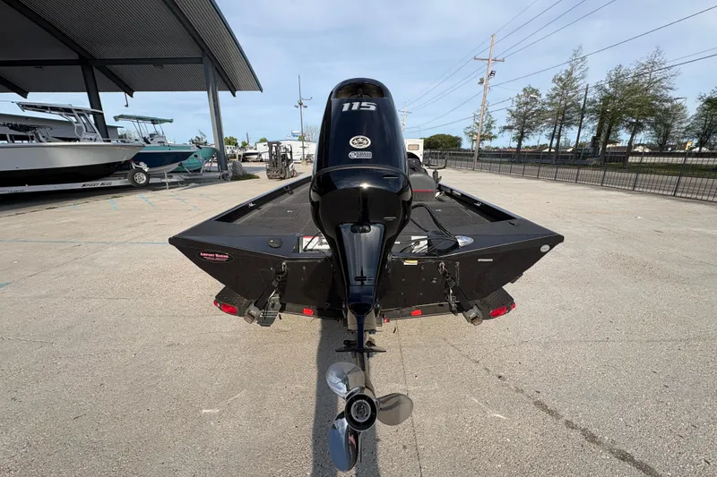 Slide: The Image of 2016 Ranger RT188 boat with Yamaha 115 outboard motor, parked outdoors. - 5