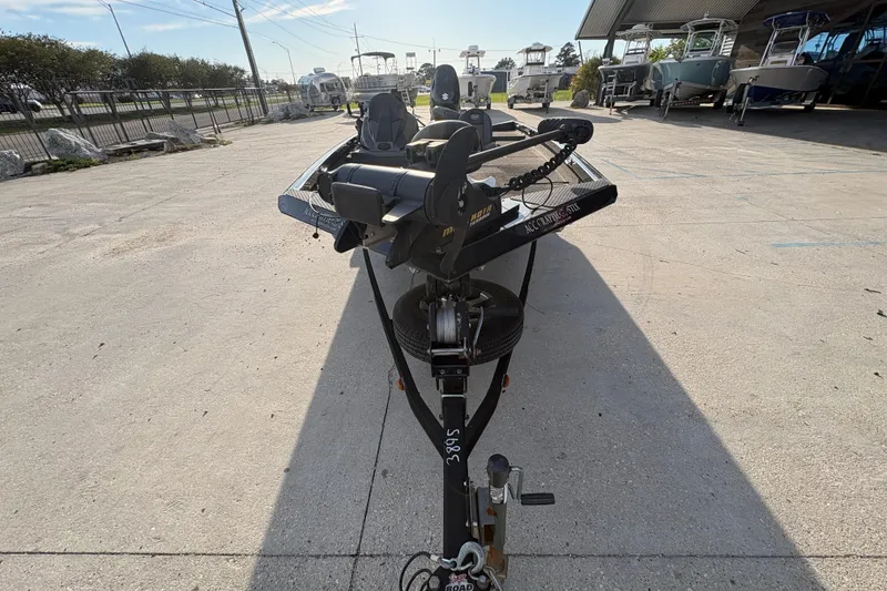 Slide: The Image of 2016 Ranger RT188 boat on trailer, parked outdoors in a marina setting. - 9