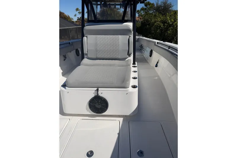 Slide: The Image of 2016 SeaHunter 35 Tournament boat interior with cushioned seating and rod holders. - 10