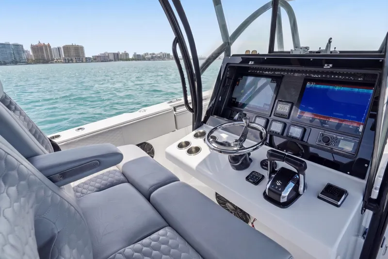 Slide: The Image of 2016 SeaHunter 35 Tournament boat cockpit with advanced navigation system and luxurious seating. - 13