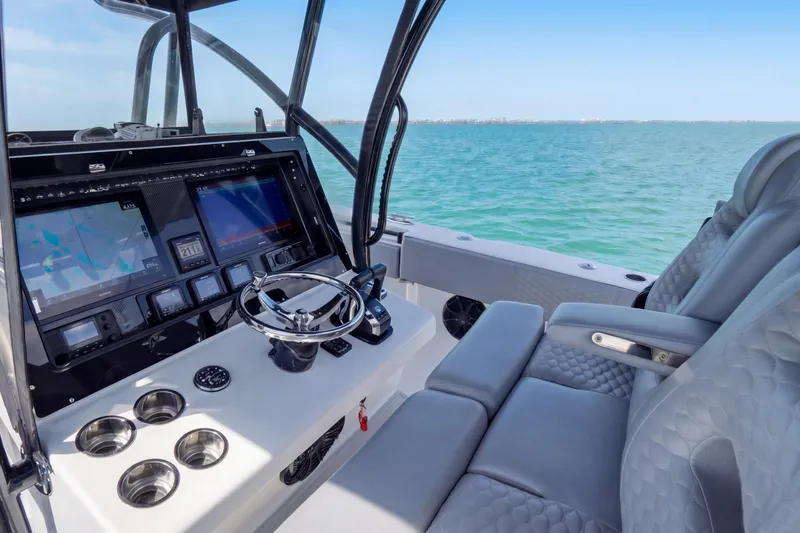 Slide: The Image of 2016 SeaHunter 35 Tournament boat cockpit with advanced navigation system and luxurious seating. - 14