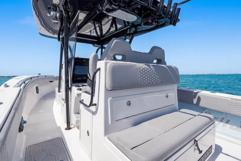 Slide: The Image of 2016 SeaHunter 35 Tournament boat interior with seating and ocean view. - 17