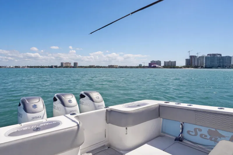 Slide: The Image of 2016 SeaHunter 35 Tournament boat with Suzuki 350 engines on calm water. - 18