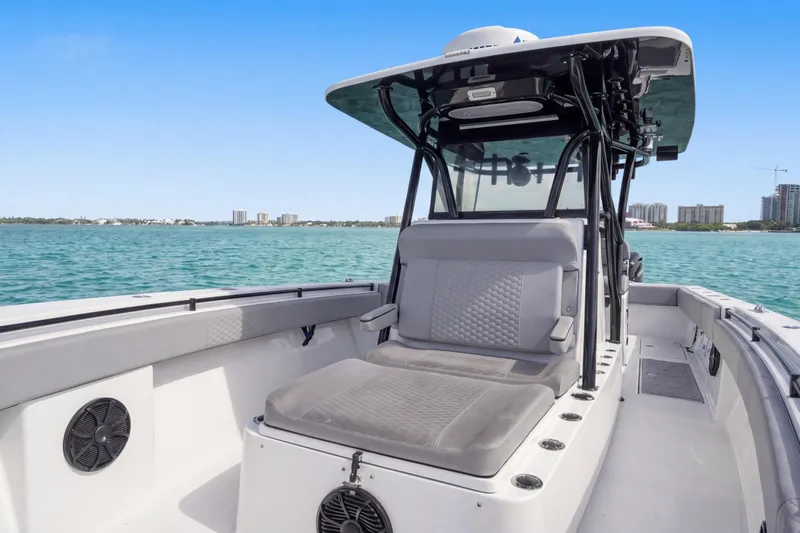 Slide: The Image of 2016 SeaHunter 35 Tournament boat on calm waters, featuring spacious seating and modern design. - 19