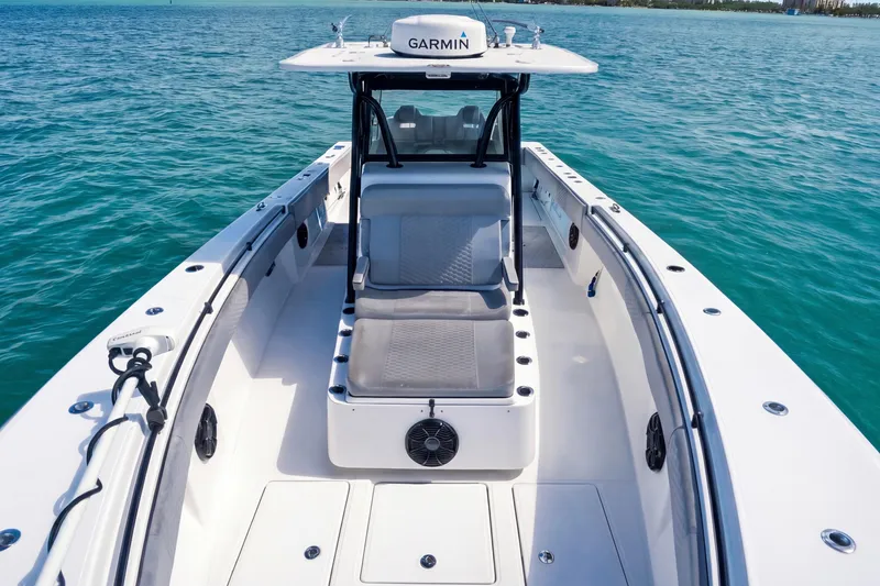 Slide: The Image of 2016 SeaHunter 35 Tournament boat on clear blue water, featuring Garmin equipment. - 20