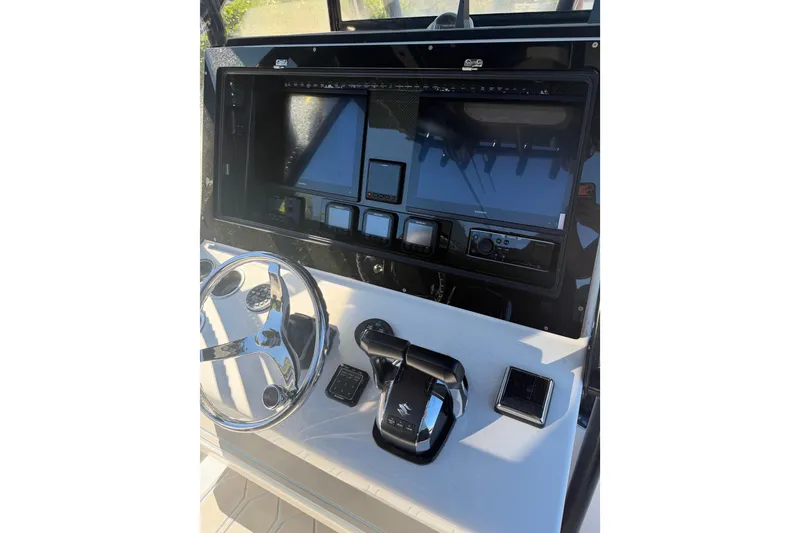Slide: The Image of Helm of 2016 SeaHunter 35 Tournament boat with advanced navigation controls. - 5
