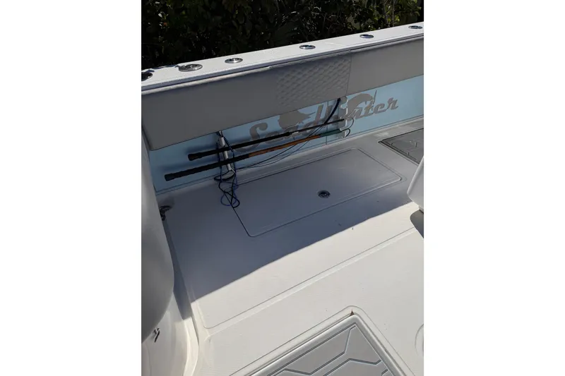 Slide: The Image of 2016 SeaHunter 35 Tournament boat deck with rod holders and storage compartments. - 8