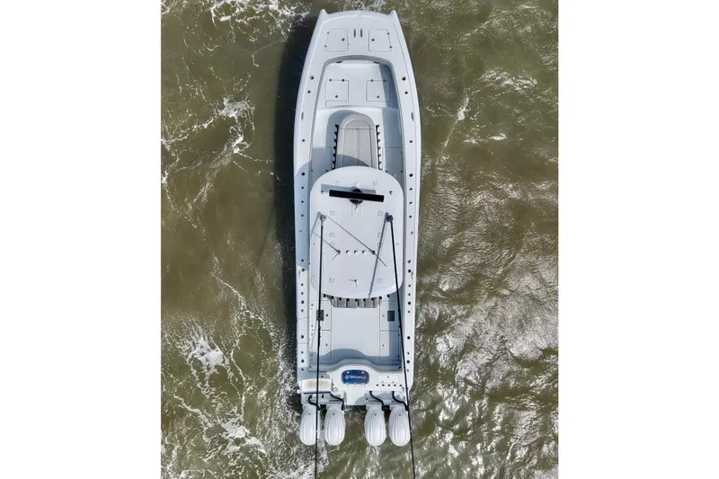 Slide: The Image of Aerial view of 2024 Freeman 38 boat navigating through choppy waters. - 11